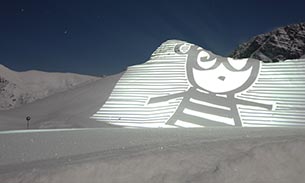 Animation projected onto a snowy mountain.