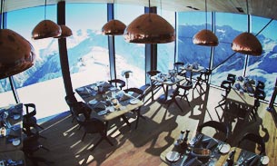 Tables and chairs in a mountain restaurant.