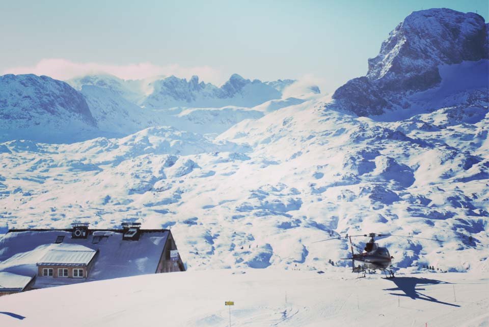 Helicopter landed on a snowy peak